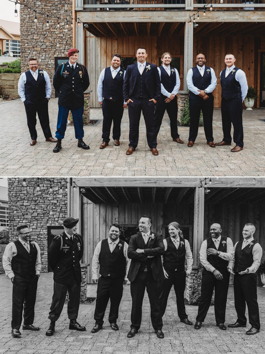 Groom and groomsmen wearing navy suits with pale pink ties at Rusty River Barn