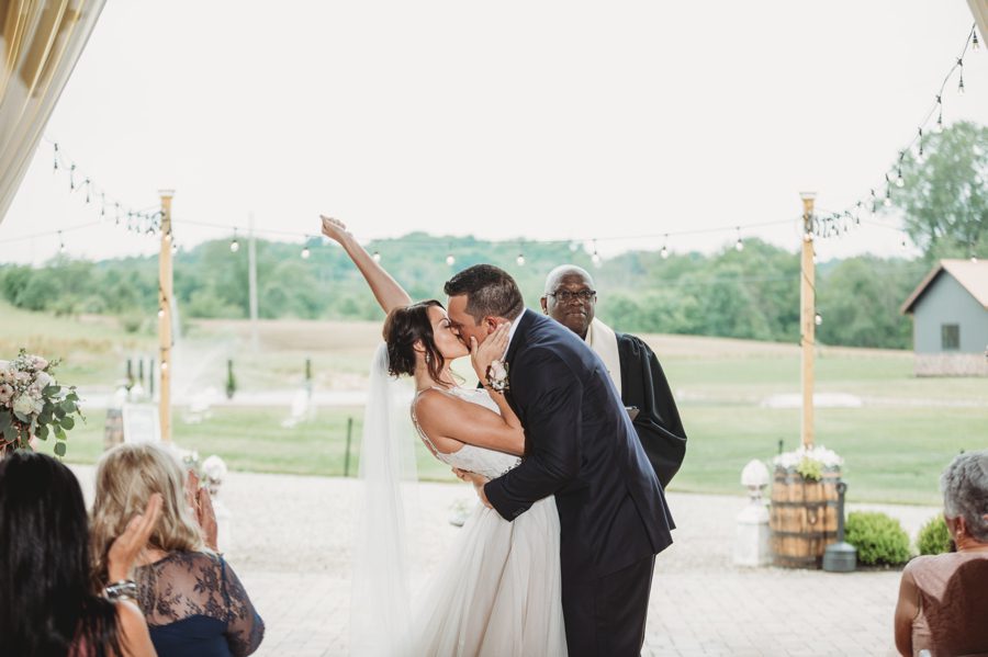 Cortni and Darren's first kiss as husband and wife with Cortni celebrating by raising her arm