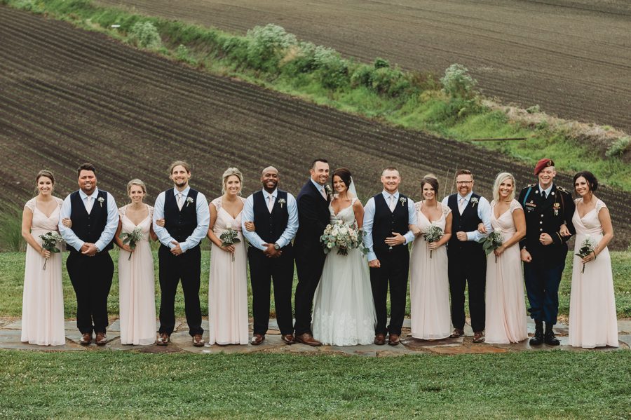 Formal capture of Darren and Cortni with their wedding party at Rusty River Barn