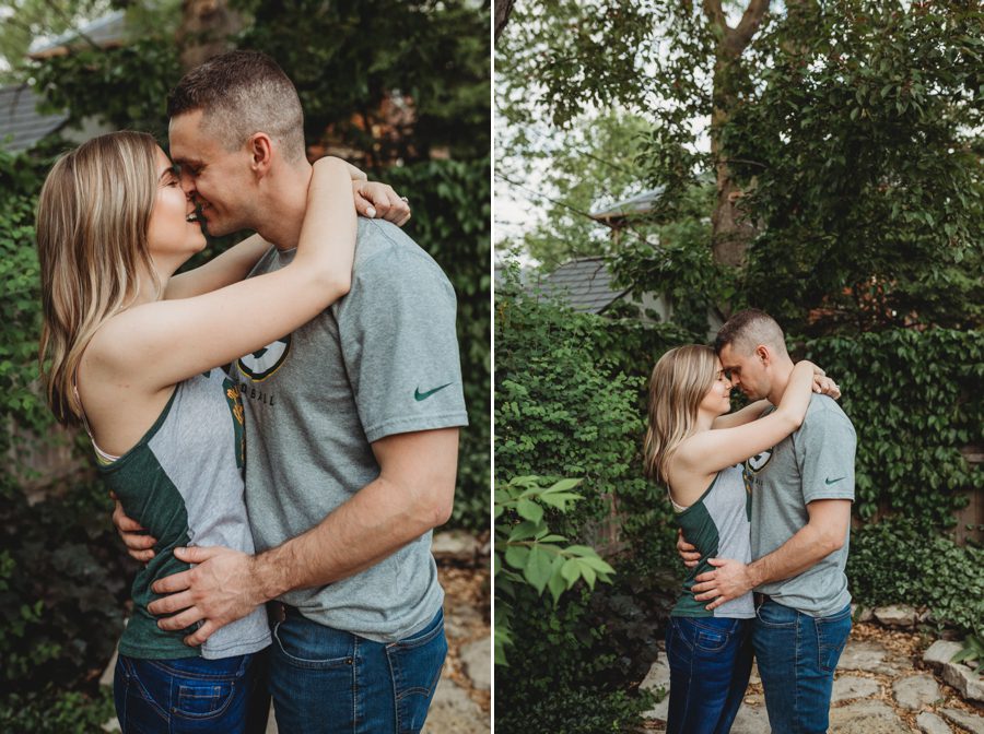 woman resting forehead on fiancé with arms wrapped around his neck