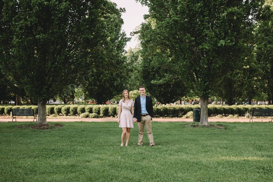Schiller Park Engagement Photos of man and woman standing side by side holding hands